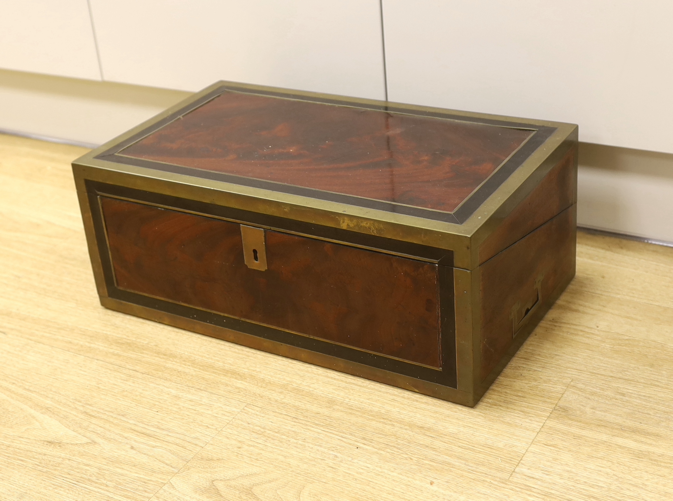 A George III mahogany, ebony and brass-mounted ship's writing box by Wells & Co., screw fixings to each side with original key, 50.5cm x 30cm x 19.5cm